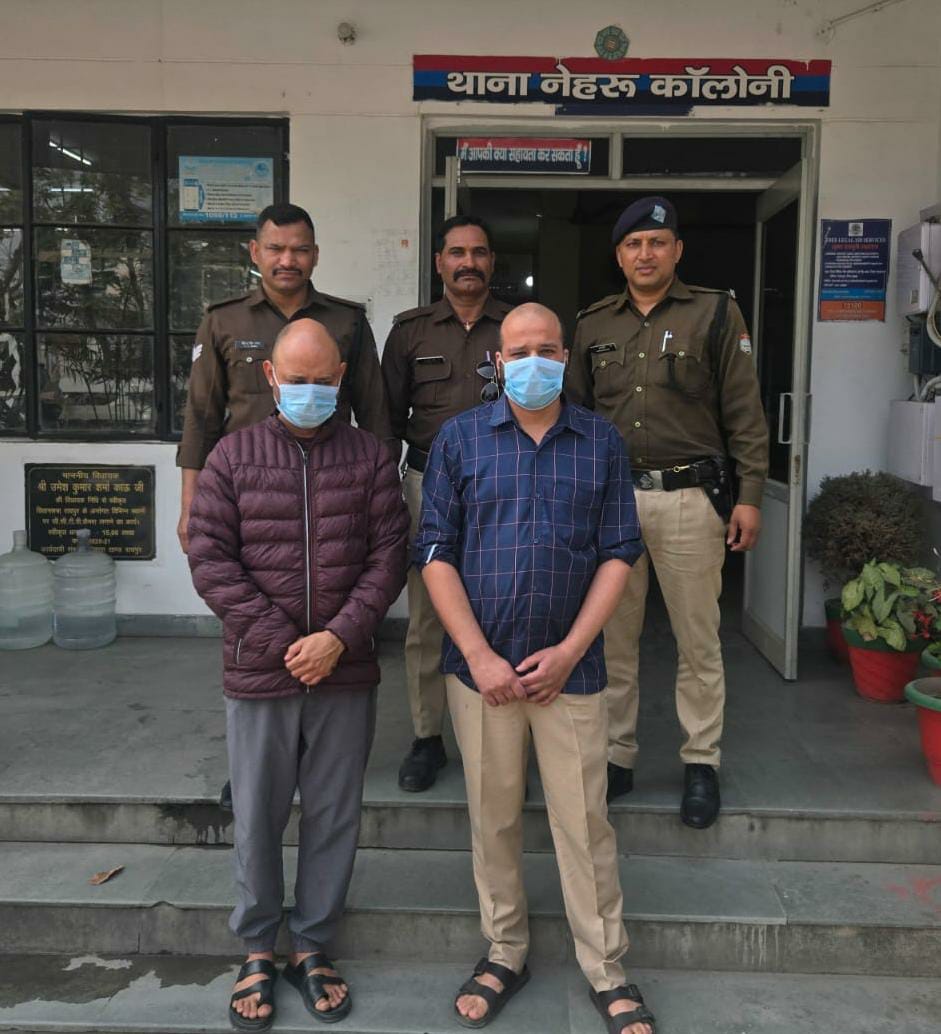 Dehradun Police team with two arrested accused for molestation during Holi in Nehru Colony.