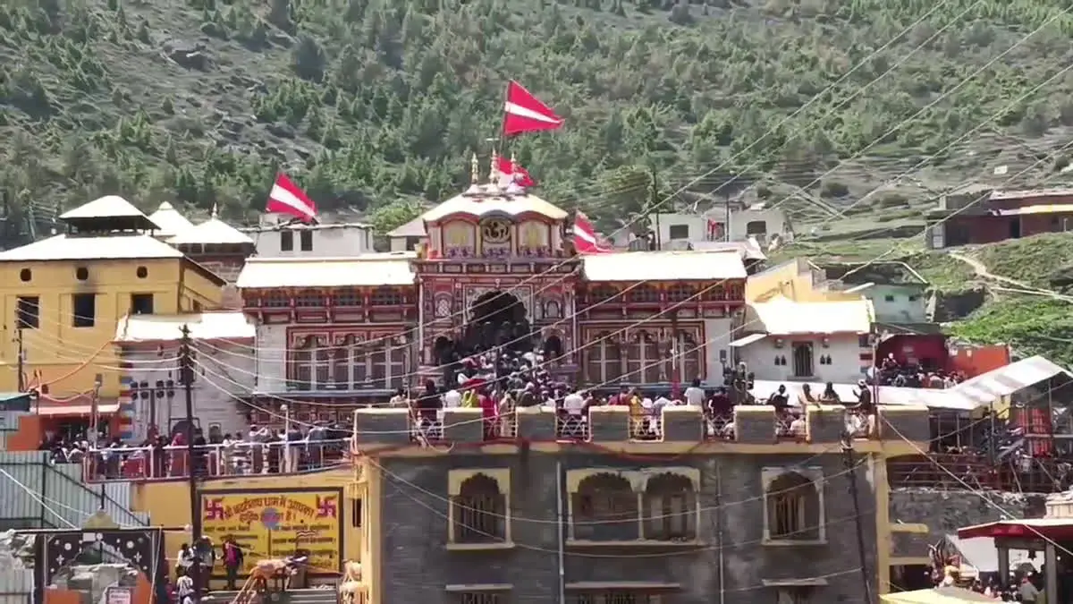 Officials reviewing documents and CCTV footage in the BKTC Financial Irregularities investigation at Badrinath Dham.