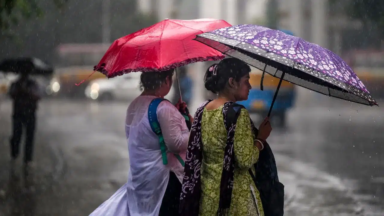 IMD Weather Alert: Dark monsoon clouds and rainfall over Indian cities as the weather department issues heavy rain warnings across multiple states.