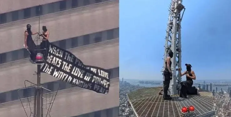 Russian couple proposing on top of the Empire State Building before being arrested in the Empire State Proposal incident in New York City.