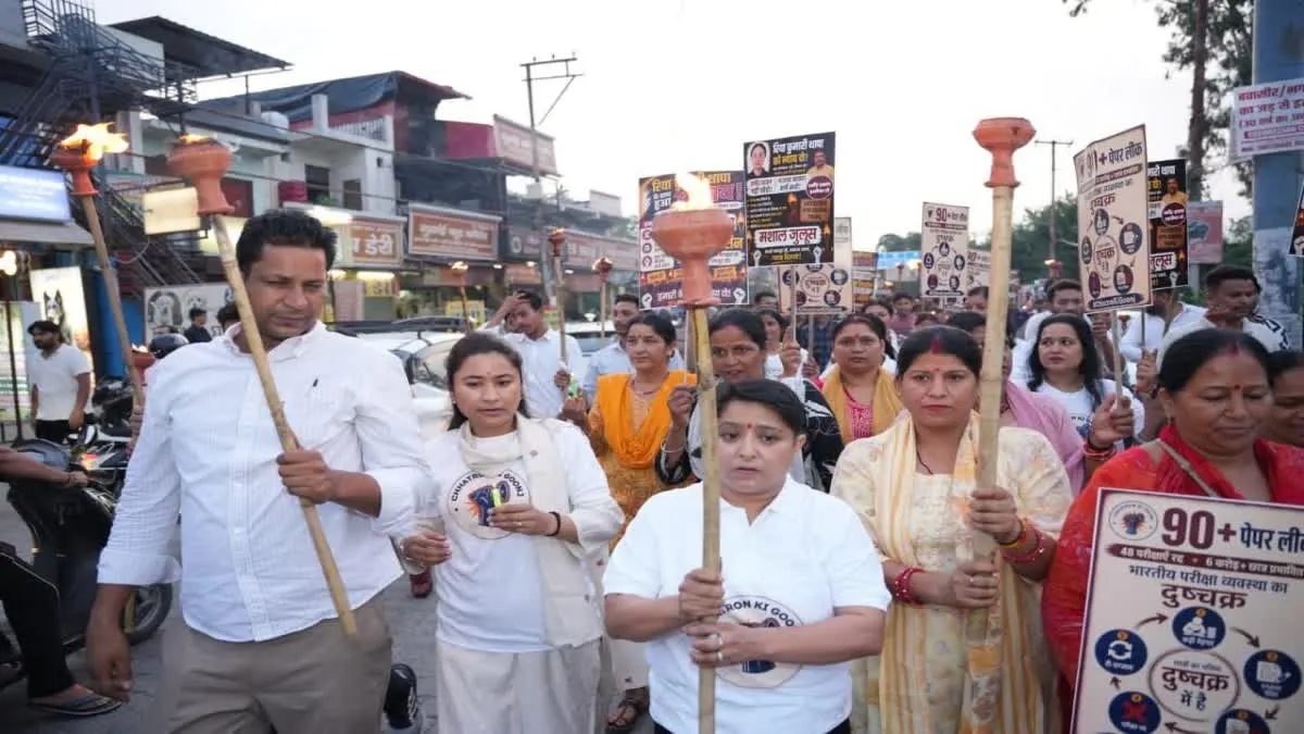 Congress workers and students participate in the NEET Paper Leak Protest candle march for Riya Thapa in Dehradun, demanding justice and transparent examination reforms.
